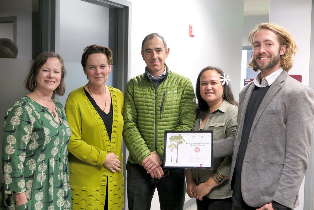 Green Office specialist presenting a Green Office Certification to the University of Utah Second Language Teaching & Research Center