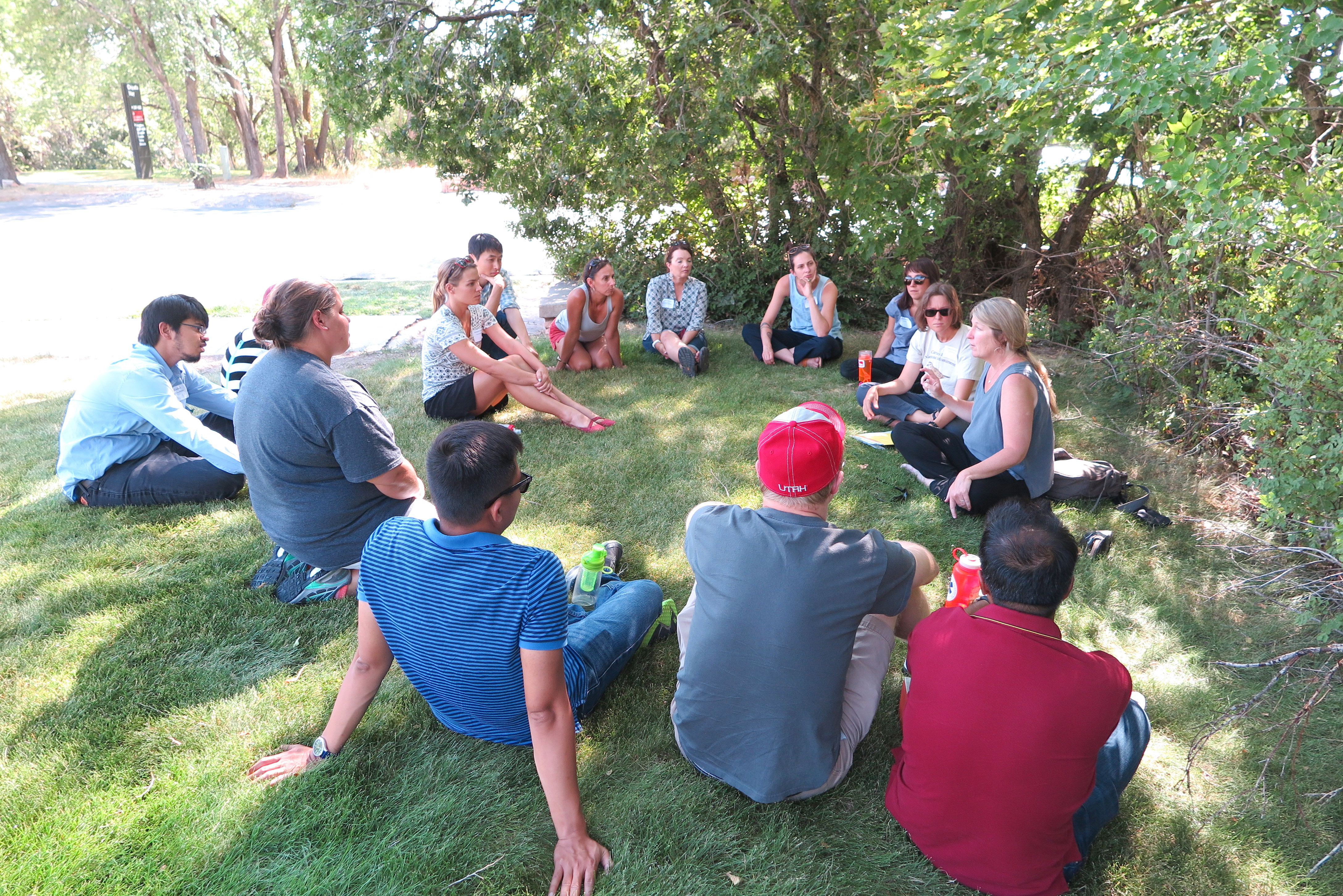 University of Utah Sustainability Schoalrs sitting in a circle and discussing sustainability.