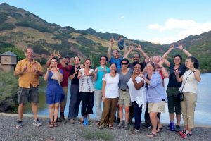University of Utah faculty "throwing up the U" while attending the Wasatch Experience.