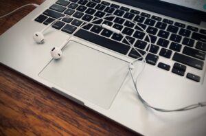 earbuds on laptop computer
